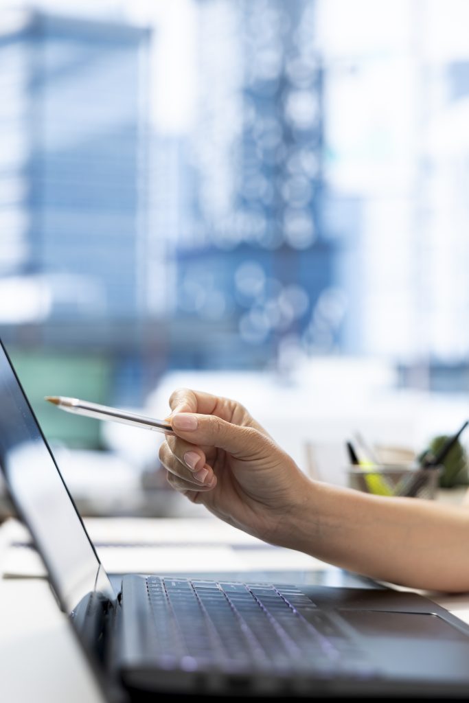 hr department worker using laptop to do background checks for job applicants
